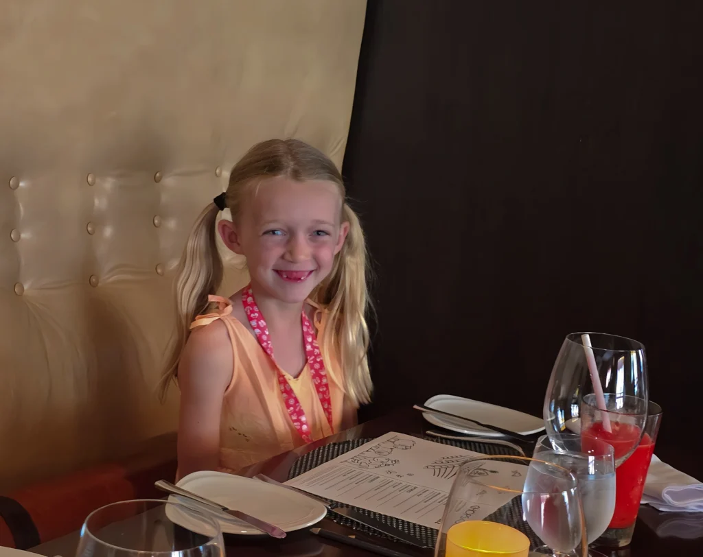 A happy child at the end of a Greek Isles cruise on Odyssey of the Seas