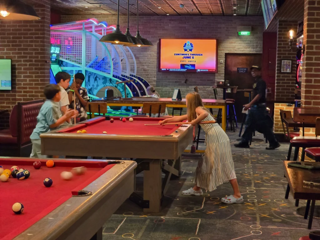 Playing pool at Playmakers on Freedom of the Seas