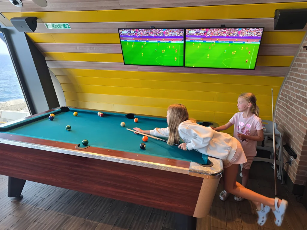 Playing Pool at Playmakers on Odyssey of the Seas