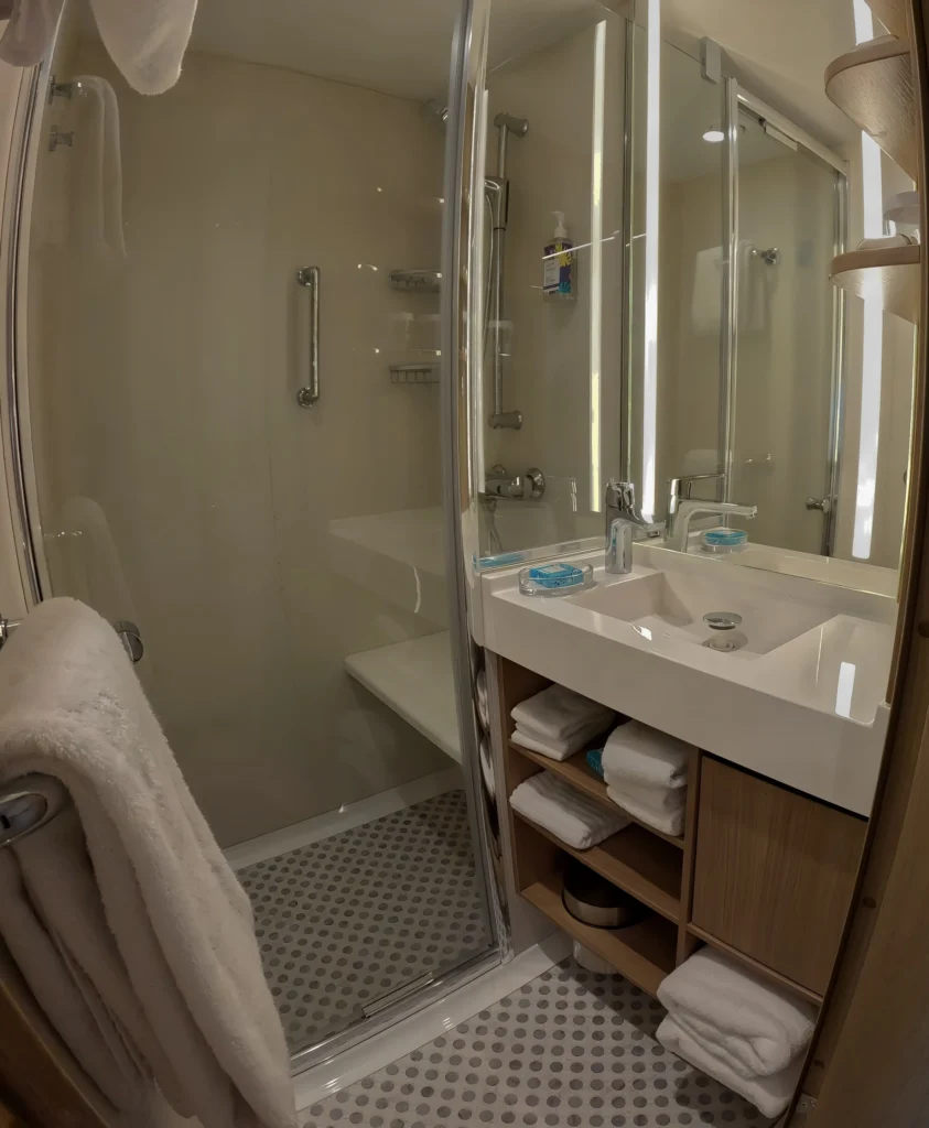The separate shower area in the Infinite Family Balcony cabin on Star of the Seas