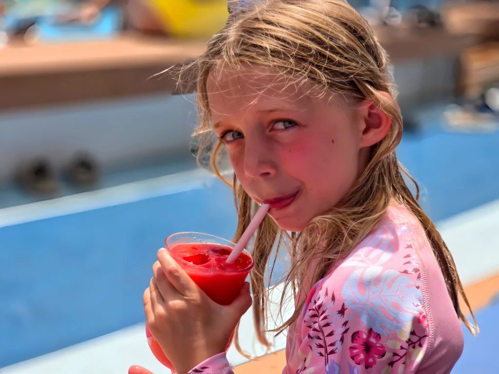 A child enjoying a virgin daiquiri on Freedom of the Seas