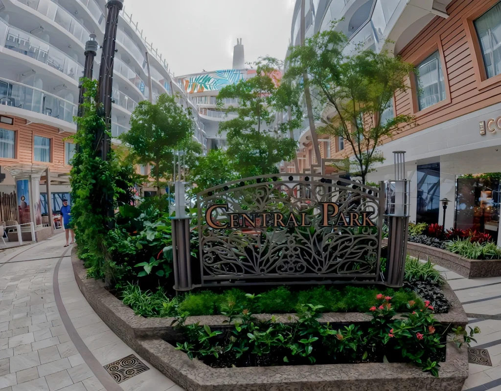 The open-air Central Park neighborhood with greenery on Utopia of the Seas
