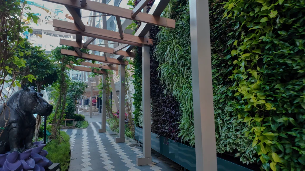 A garden walkway through Central Park on Utopia of the Seas