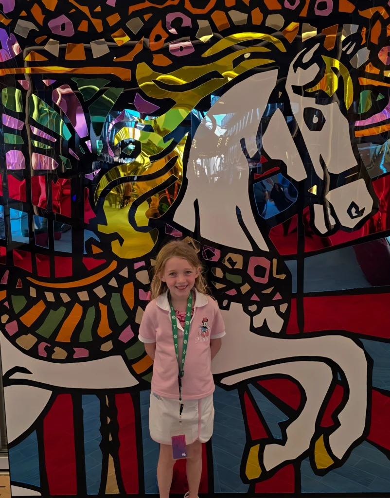 My daughter on the Boardwalk on Utopia of the Seas