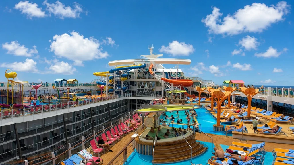 The main pool deck on Utopia of the Seas on a sunny day