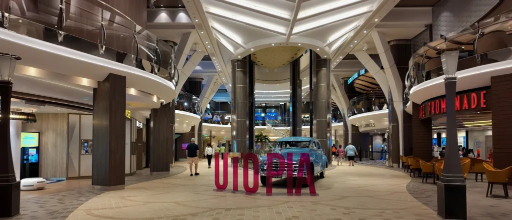 A classic car on display along the Royal Promenade on Utopia of the Seas