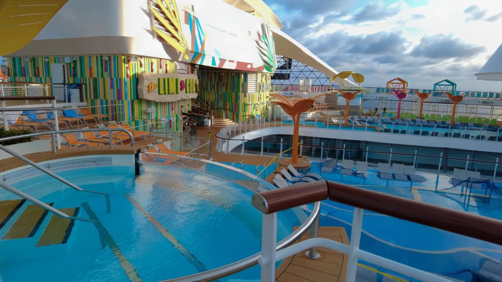 An infinity-edge hot tub on the upper pool deck on Utopia of the Seas