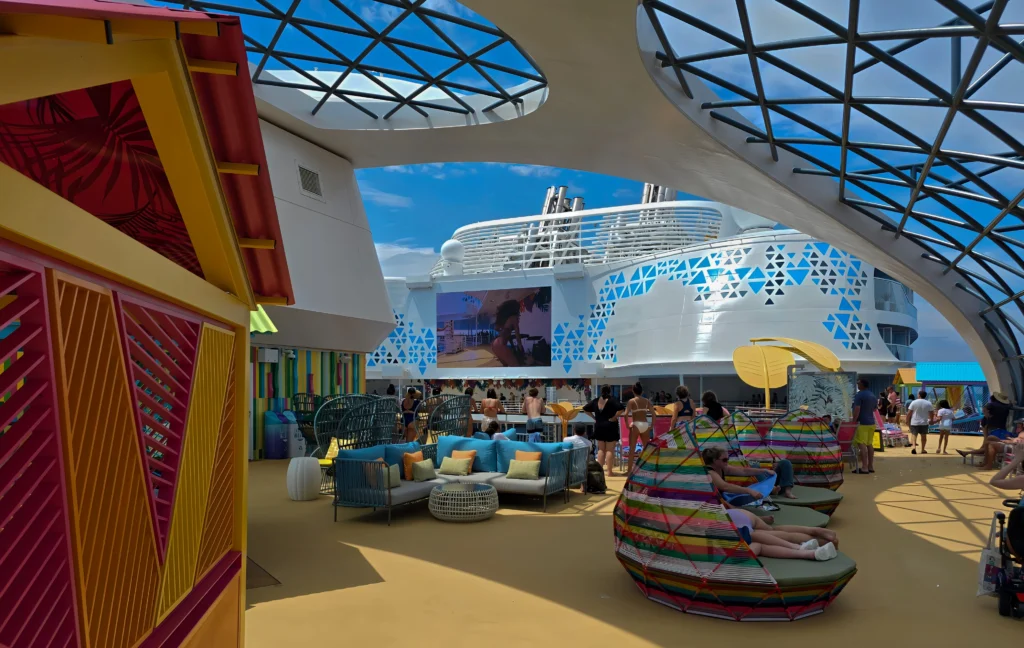 The seating area on the upper pool deck on Utopia of the Seas