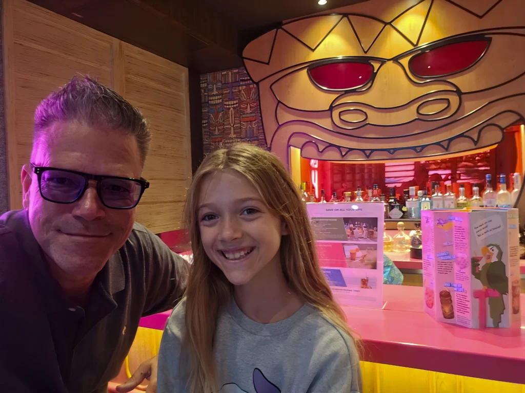 Family smiles aboard Utopia of the Seas