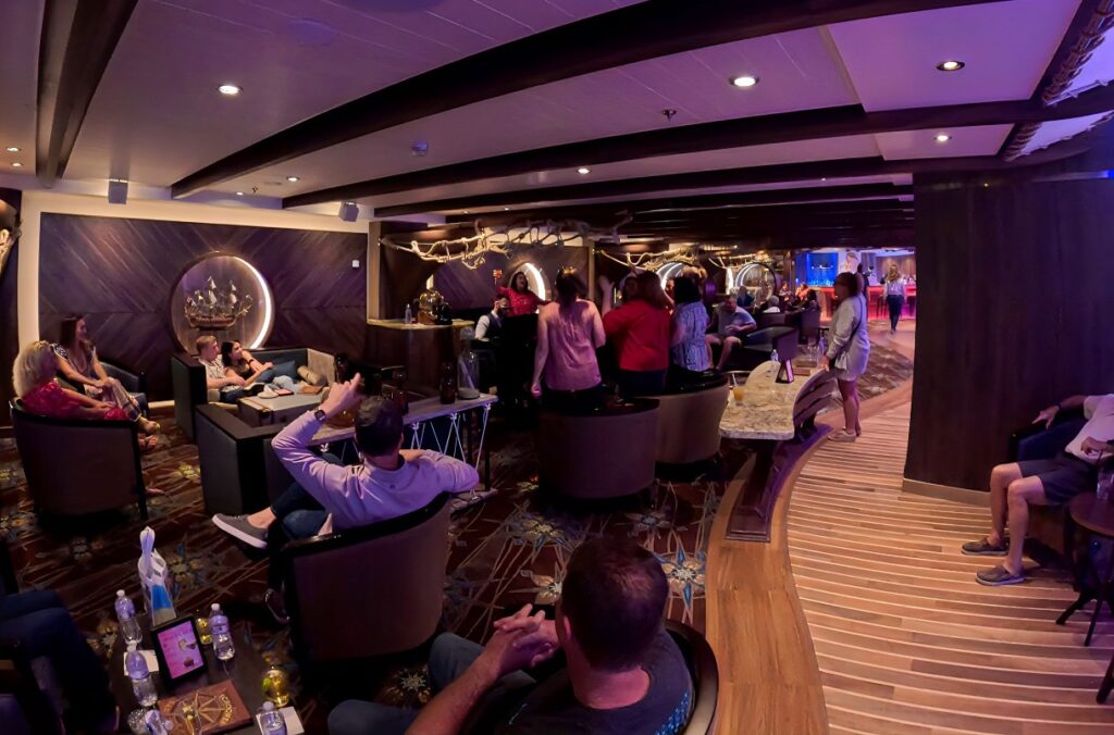 A piano player at the Schooner Bar on Utopia of the Seas